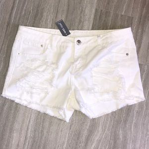 White ripped shorts
